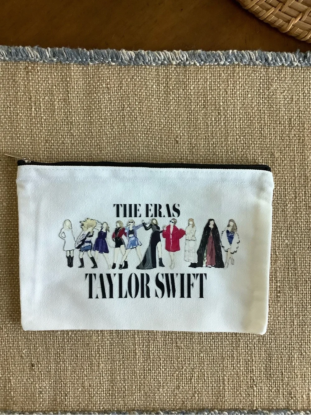 Five Taylor Swift White 'The Eras' Zip Pouches with Multicolor Illustration